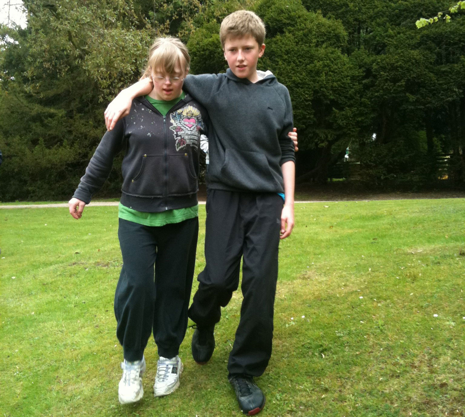 image of 2 young people in a field